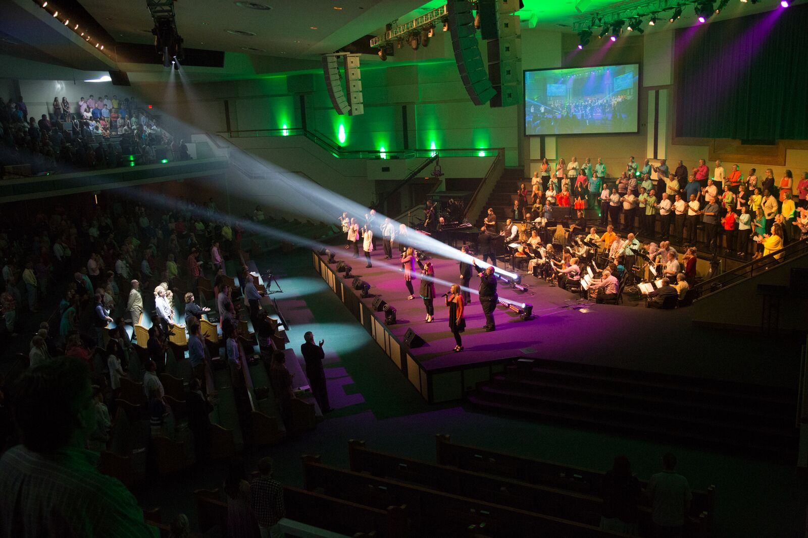 Congregation gathered for Sunday worship with choir and musicians.