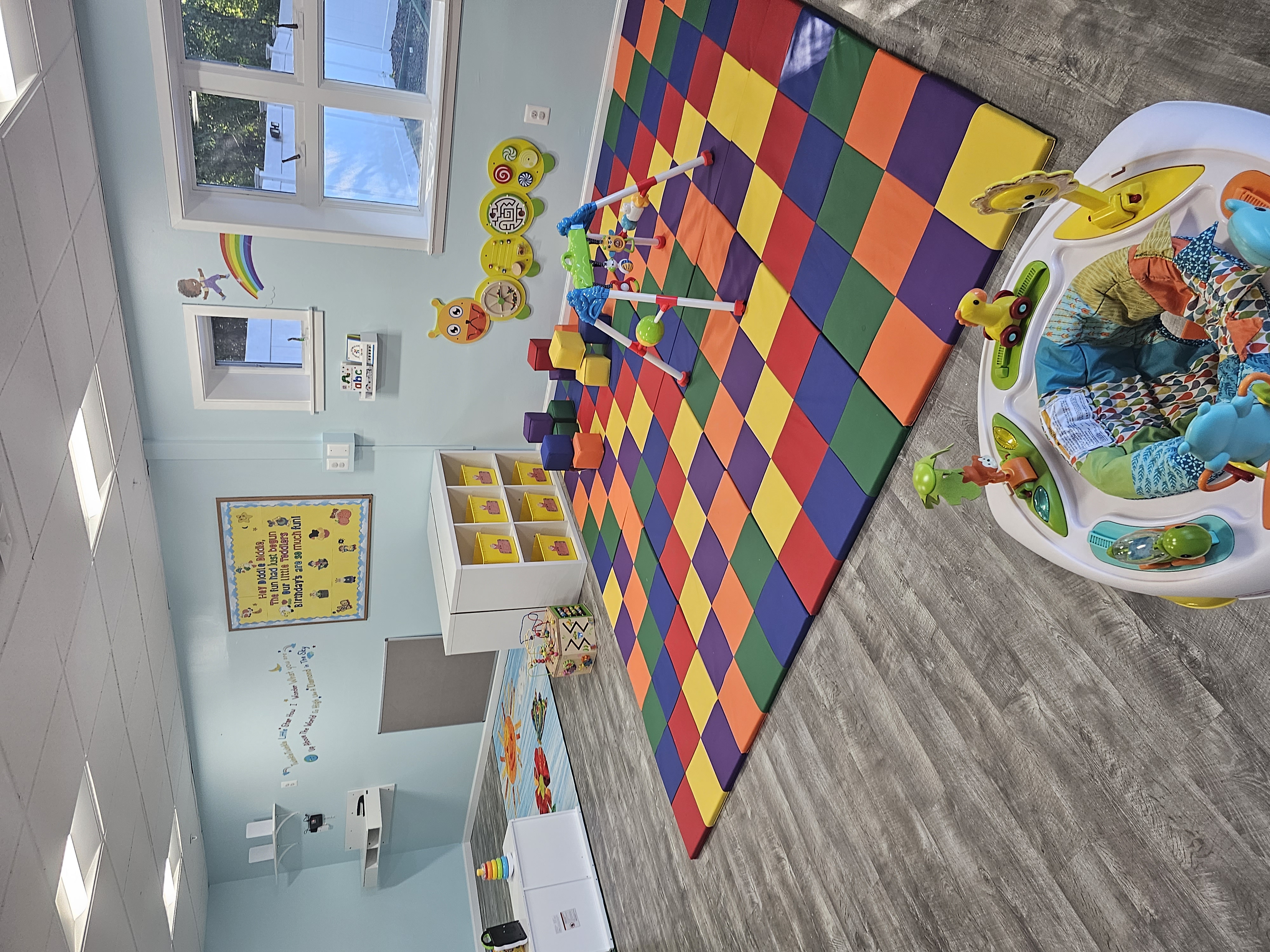 Representative nursery and early childhood room with toys and child-friendly furnishings.